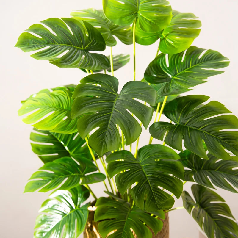 arbre tropical artificiel avec grandes feuilles de monstera décoratif