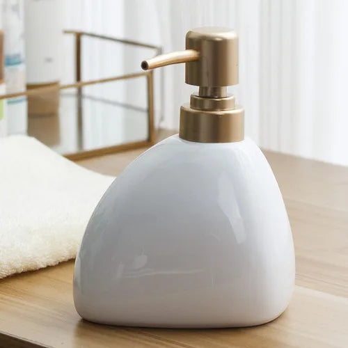 distributeur de savon en céramique avec pompe dorée pour salle de bain