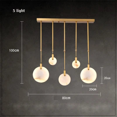 lustre design en marbre doré avec éclairage led tendance 2024