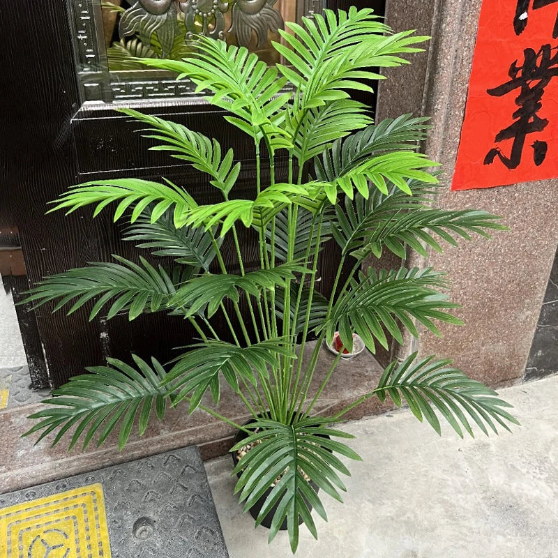 grand palmier artificiel avec branches de monstera pour décoration extérieure