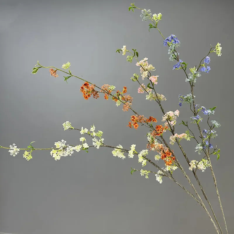 décoration de table en fleurs artificielles et saule neige