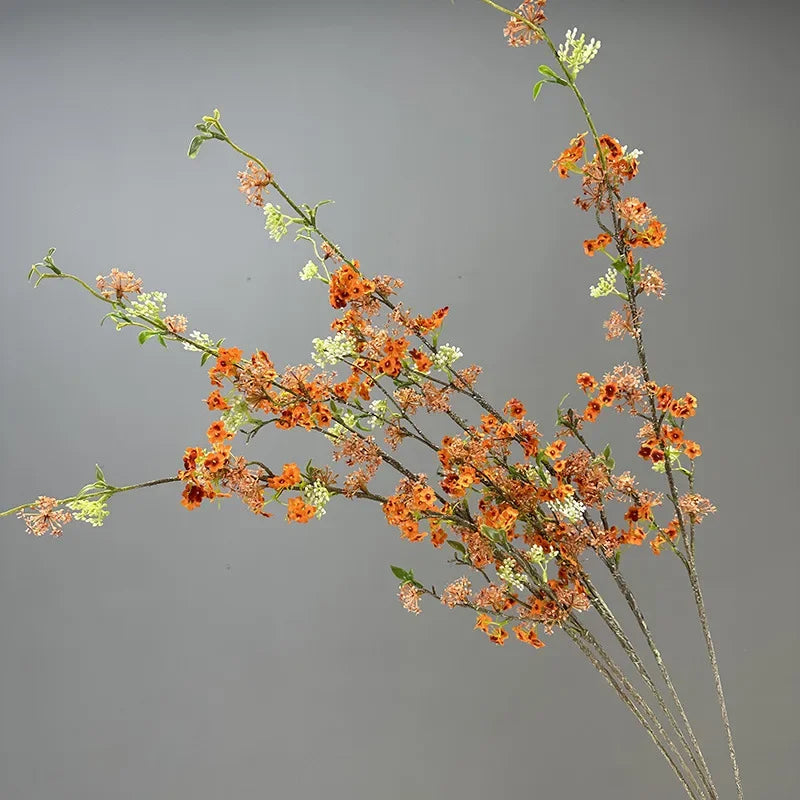 décoration de table en fleurs artificielles et saule neige