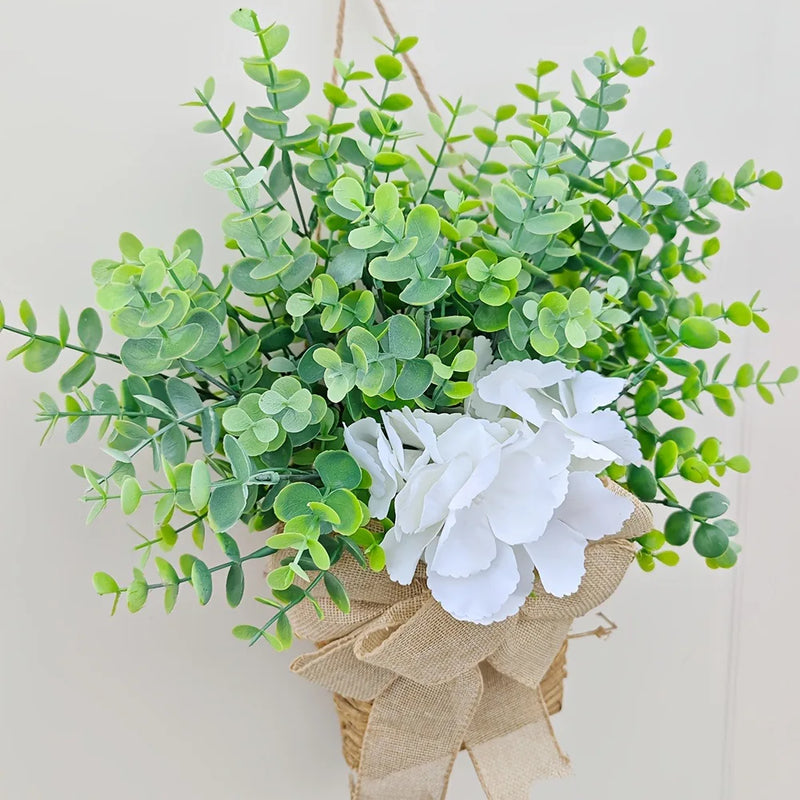 couronne de printemps en eucalyptus et fleurs blanches décorative