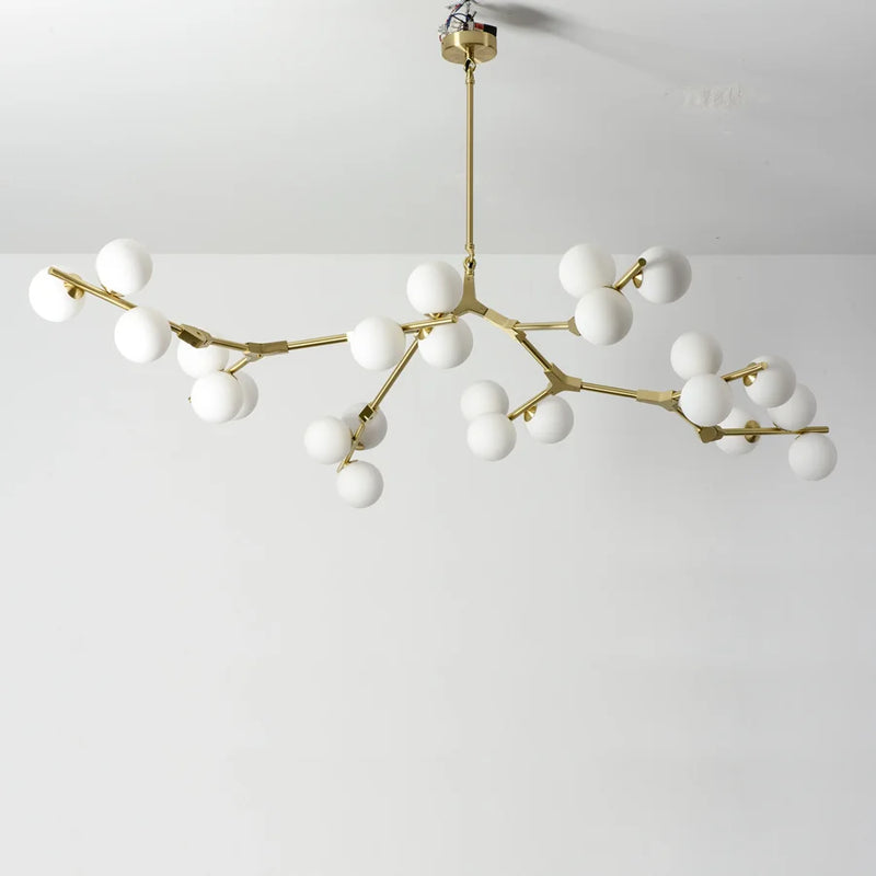 lustre en verre avec branches d'arbre et boules lumineuses