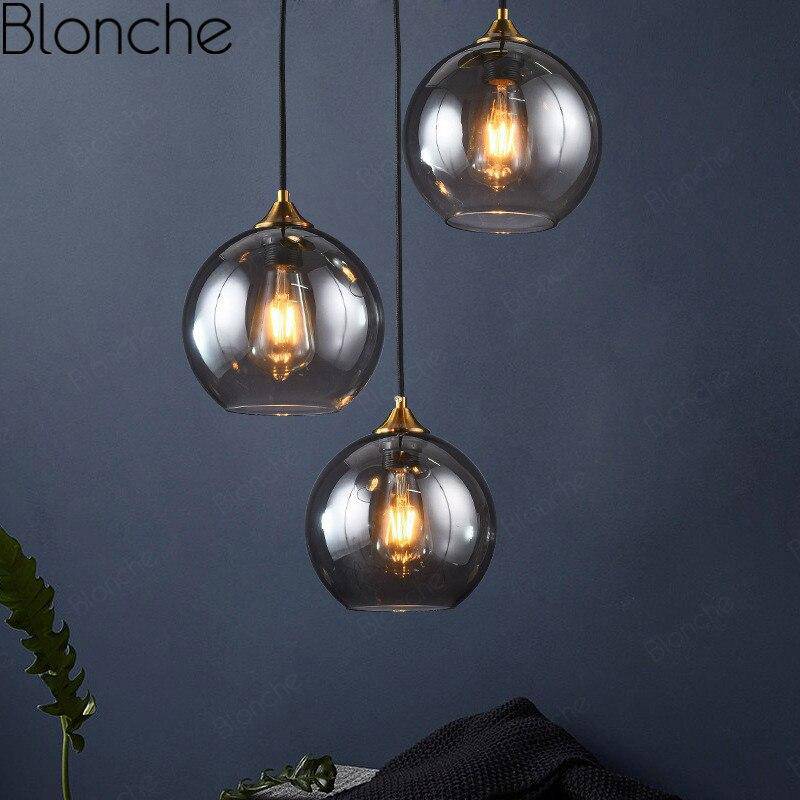 Suspension design boule en verre ambré loft