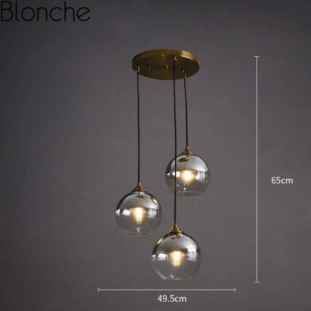 Suspension design boule en verre ambré loft