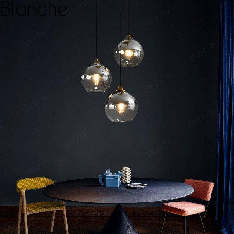 Suspension design boule en verre ambré loft